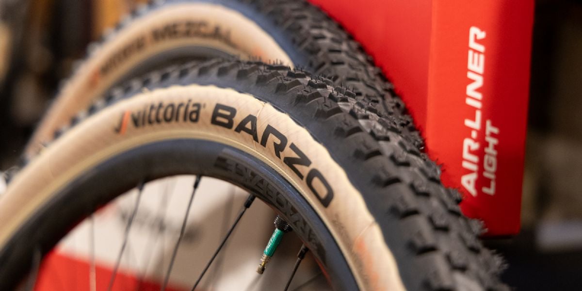 Mountain bike wheels leaning against box.