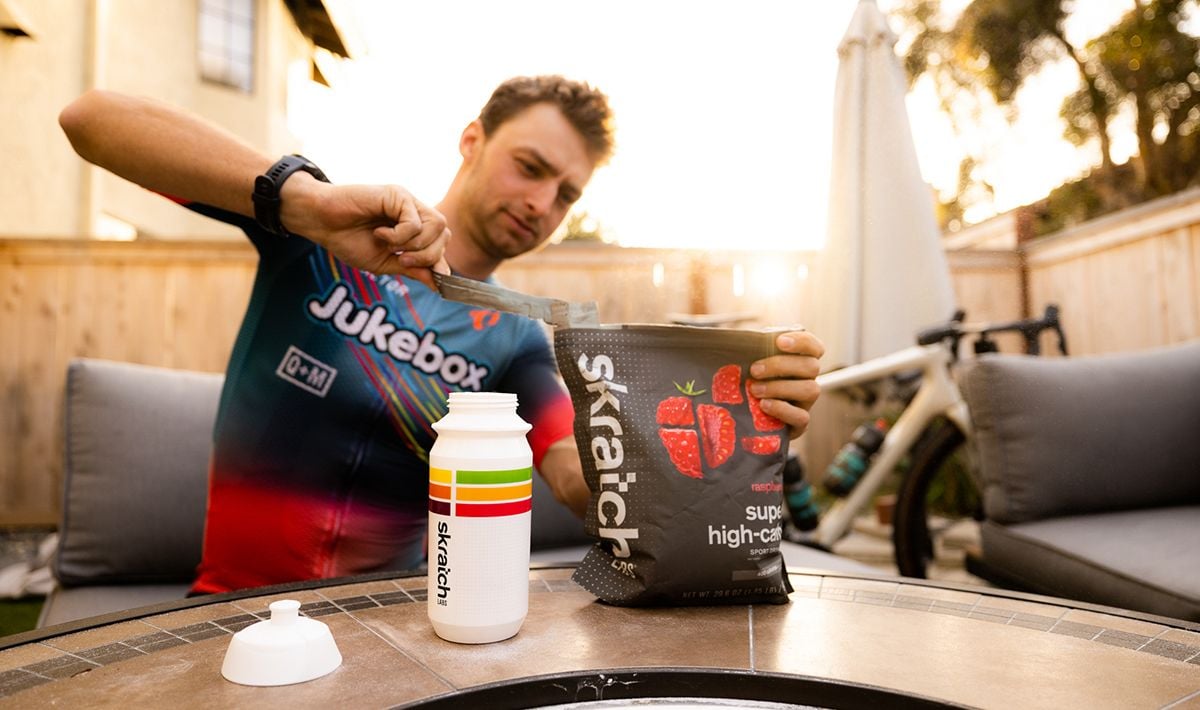 Person opening bag of drink mix