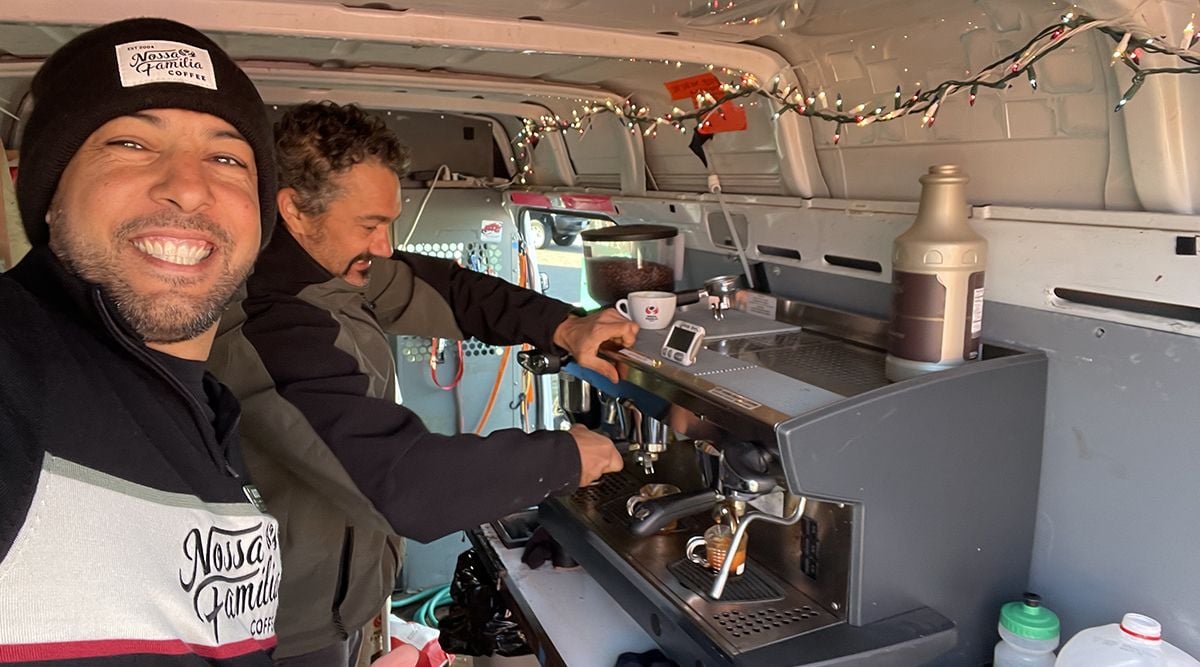 Augusto serving coffee at cycling event