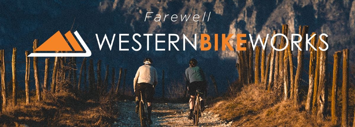 two bicycle riders heading off into the distance, with text overlay that says farewell western bikeworks