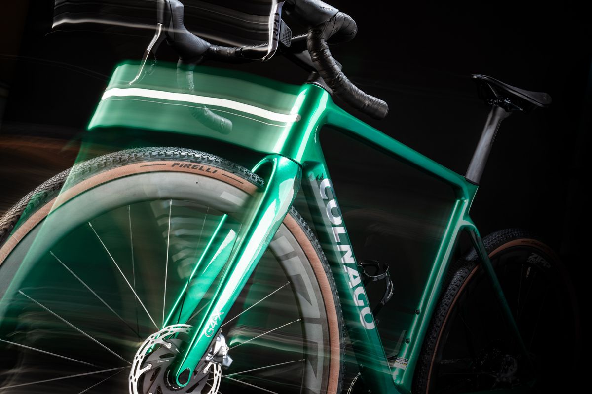a green colnago g4-x with motion blur effects on a black background